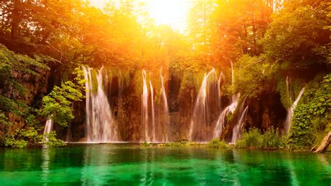 Serene Waterfall A Vibrant HD Wallpaper Of Nature S Beauty