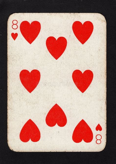 Vintage Eight Of Hearts Playing Card On A Black Background Stock Image