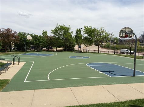 The Basketball Court In This Park Is Curved Tennis Court Basketball