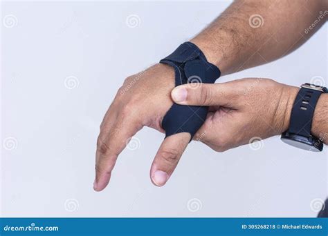 A Man Massages the First Metacarpal Joint. Wearing an Ultra-thin ...