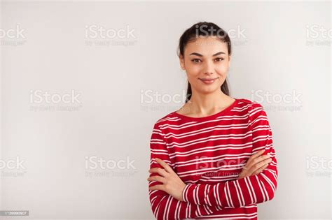 Portrait Of Young Beautiful Cute Cheerful Girl Smiling Looking At