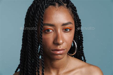 Shirtless Black Woman With Makeup Posing And Looking At Camera Stock