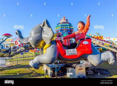 Young Asian Girl Enjoying Carnival Fun Fair Ride Stock Photo Alamy