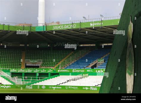 Real Racing Football Club closed stadium through a metal fence at an entrance with empty stands ...