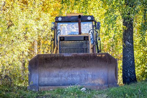 Front View Of The Yellow Bulldozer In Autumn Forest Stock Image Image