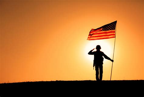 USA Soldier with flag saluting on sunset horizon - WINDFM - 92.5 ...