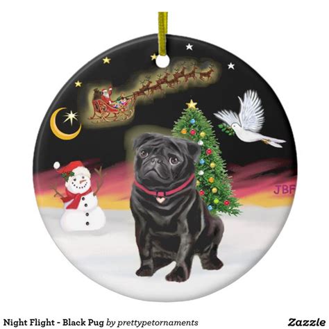 A Black Pug Ornament With A Christmas Tree And Snowman