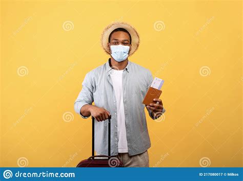 African American Man In Medical Mask Holding Passport Airplane Tickets