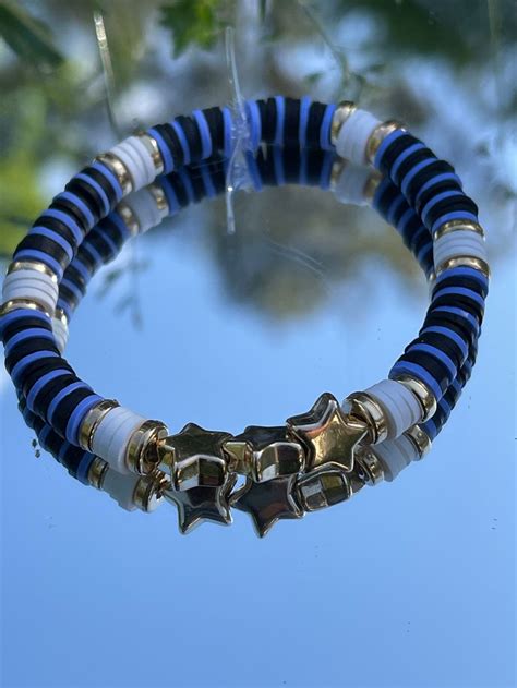 This Is A Blue Black Gold And White Clay Bead Bracelet With Star