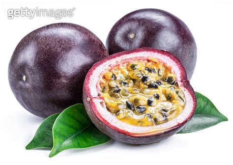 Passion Fruits And Its Cross Section With Pulpy Juice Filled With Seeds