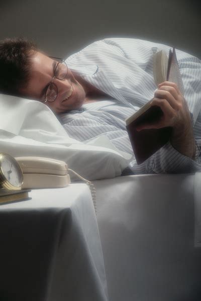 Man reading in bed Free Photo Download | FreeImages