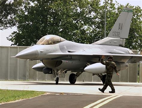 Airman St Class Dearl Stevens Directs An F Fighting Falcon After