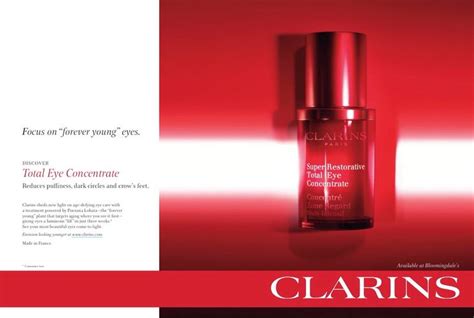 An Advertisement For Clarins Cosmetics Featuring A Red Bottle With The