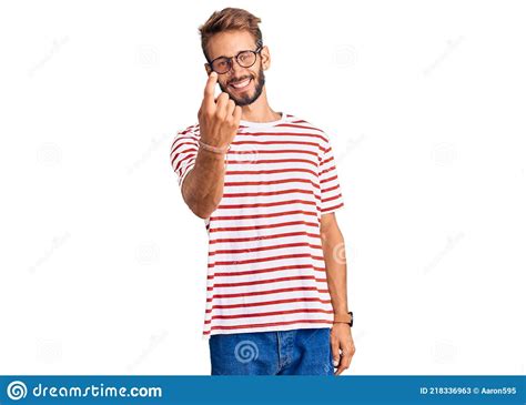 Handsome Blond Man With Beard Wearing Casual Clothes And Glasses