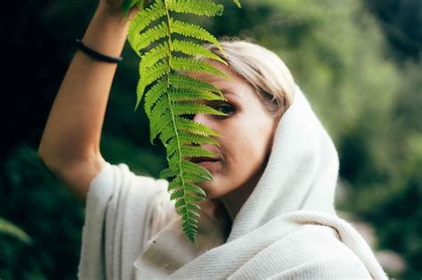 Premium Photo Midsection Of Woman Holding Plant