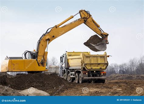 Digger Loading Trucks With Soil Stock Image Image Of Site Equipment