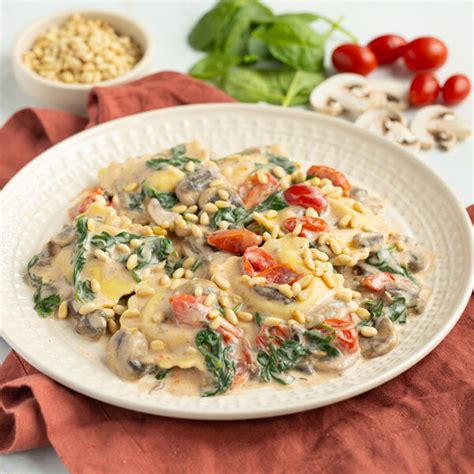 Mealime Creamy Tuscan Ravioli With Mushrooms Tomatoes Spinach And Pine Nuts