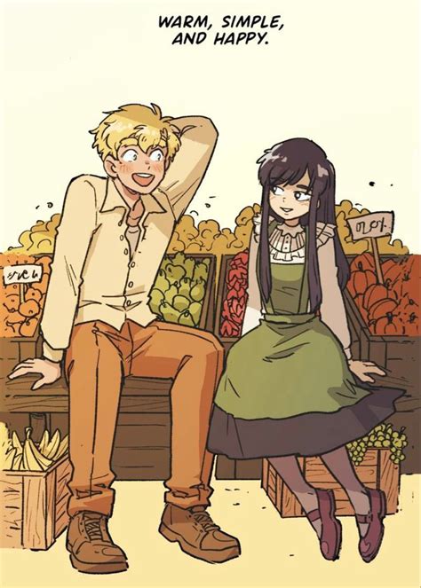 A Man Sitting Next To A Woman On Top Of A Wooden Bench In Front Of Pumpkins