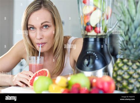 Pretty Blonde Woman Holding Her Homemade Smoothie Stock Photo Alamy