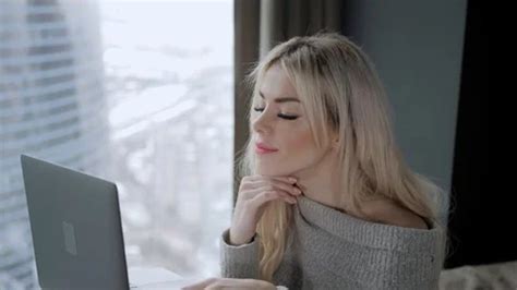 Beautiful Blonde Woman Sitting On The Be Stock Video Pond