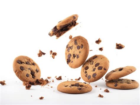 Premium AI Image Tasty Chocolate Chip Cookies Falling Isolated On