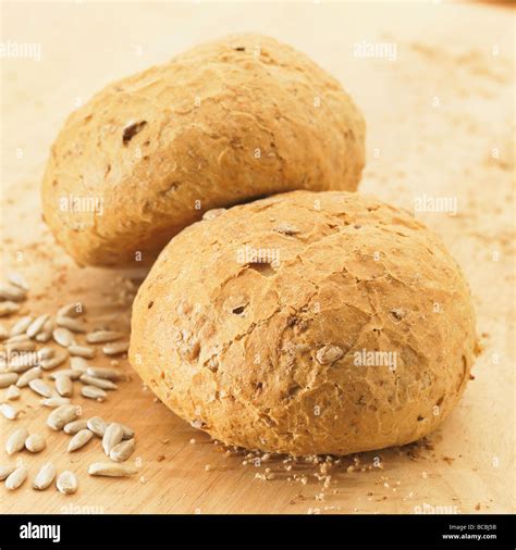 Two Rustic Wholemeal Bread Rolls With Sunflower Seeds Stock Photo Alamy