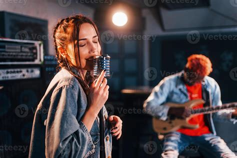 Guy Plays Guitar Girl Sings African American Man With White Girl