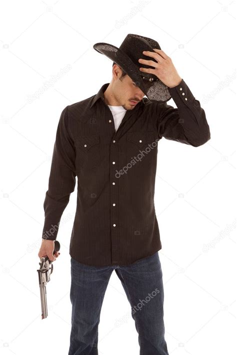 Cowboy holding hat and gun — Stock Photo © alanpoulson #11971648