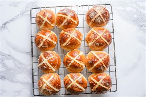 Premium Photo Traditional Easter Hot Cross Buns On A Cooling Rack AI Generated