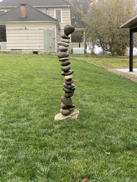 Rock Balancing Sculpture in front of a Condo unit. : r/mildlyinteresting