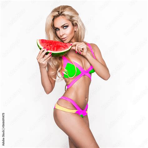 Elegant Sexy Woman In The Colorful Bikini On The Sun Tanned Slim And