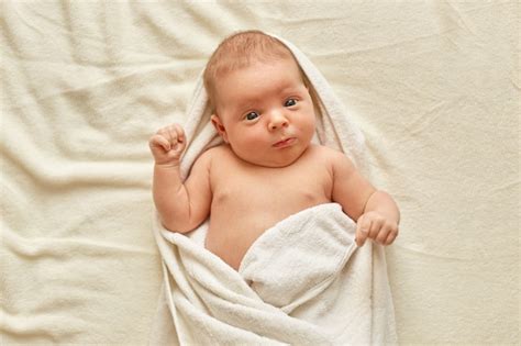 Free Photo | Newborn baby wearing towel after bath, cute tiny child ...