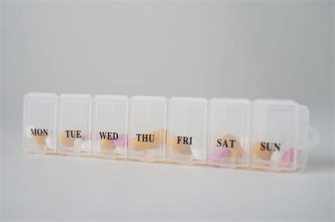 Premium Photo Daily Pill Box With Medications And Nutritional Supplements