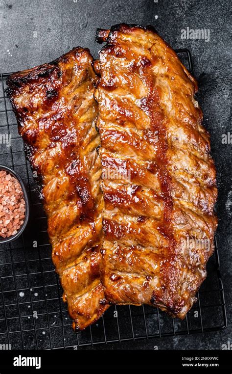 Bbq Grilled Pork Spare Ribs On A Rack Black Background Top View Stock