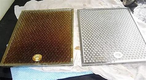 Two Metal Grates Sitting Next To Each Other On A Table