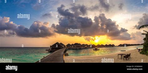 Panorama of Tropical sunset over bungalows at Tropical beach in the ...