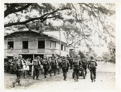 Us Servicemen Marching Along Filipino Road Philippine Islands