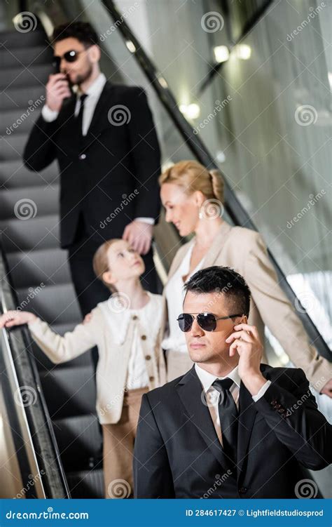 Personal Security Concept, Handsome Bodyguards Communicating Stock ...