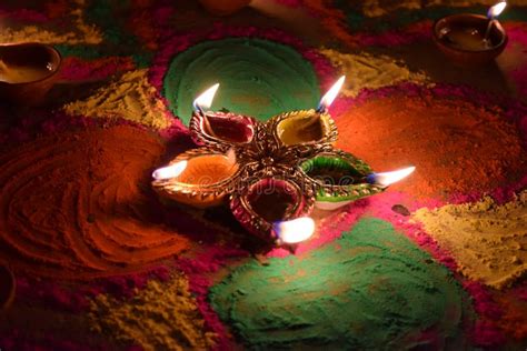 Oil Lamps Lit on Colorful Rangoli during Diwali Celebration in India ...