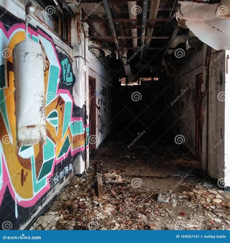 Dark Hallway and Colorful Graffiti Covered Wall in an Abandoned ...