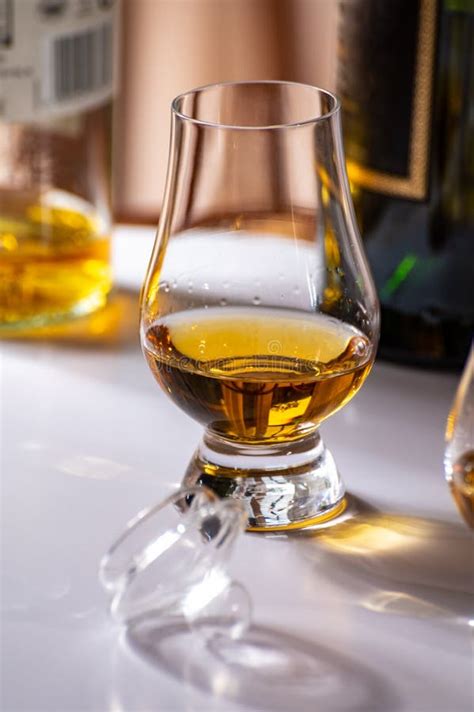 Tasting Of Whiskey Tulip Shaped Tasting Glasses With Dram Of Scotch