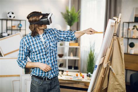 Talented Artist Wearing VR Headset while Painting on Easel Stock Photo ...