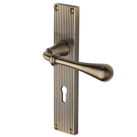 Heritage Roma Reeded Lock Door Handles Antique Brass Lacquered Broughtons Lighting And Ironmongery