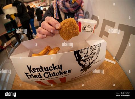 A Woman Enjoys A Combo Order Of Beyond Fried Chicken At A Kfc In Midtown Manhattan On Its Launch