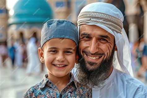 Premium Photo | Muslim father and son smiling to camera in front of mosque