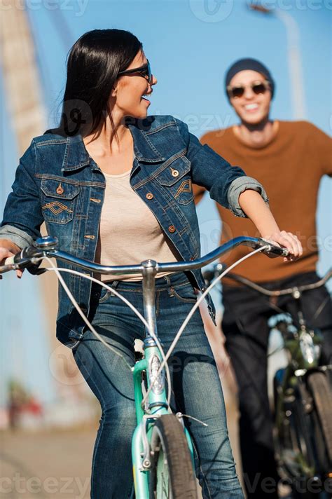 I Am The First Beautiful Young Woman Riding Bicycle And Looking Over