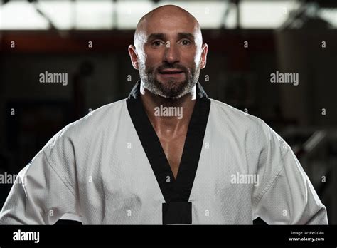 Portrait Of A Physically Fit Mature Man In Kimono With Black Belt Stock