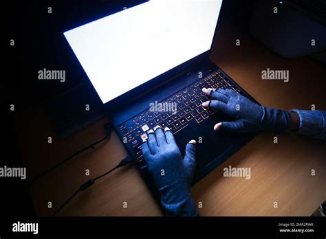 Hacker Hand Stealing Data From Laptop Top Down Stock Photo Alamy