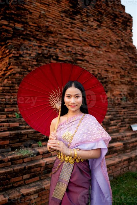 Beautiful Thai Girl In Traditional Dress Costume Red Umbrella As Thai