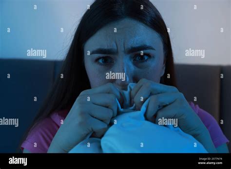 fear  darkness scared young woman  bed  room  night stock